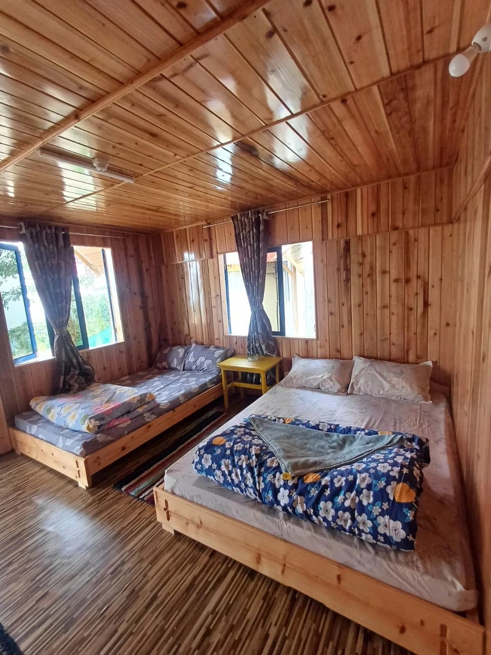 Rigsel Homestay Double Bed Room Type B — bright airy interior with forest views